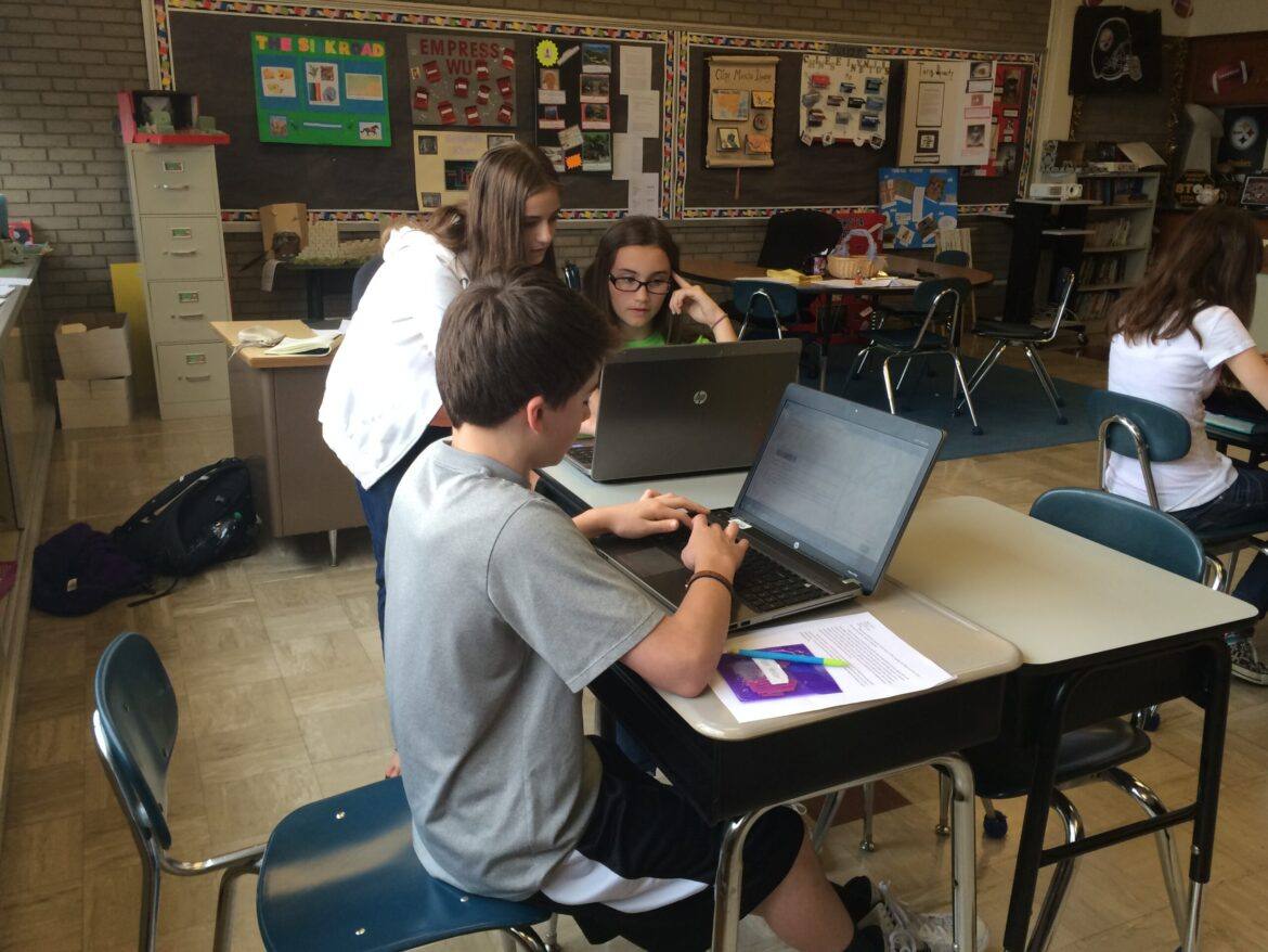 A87 Students collaborating writing