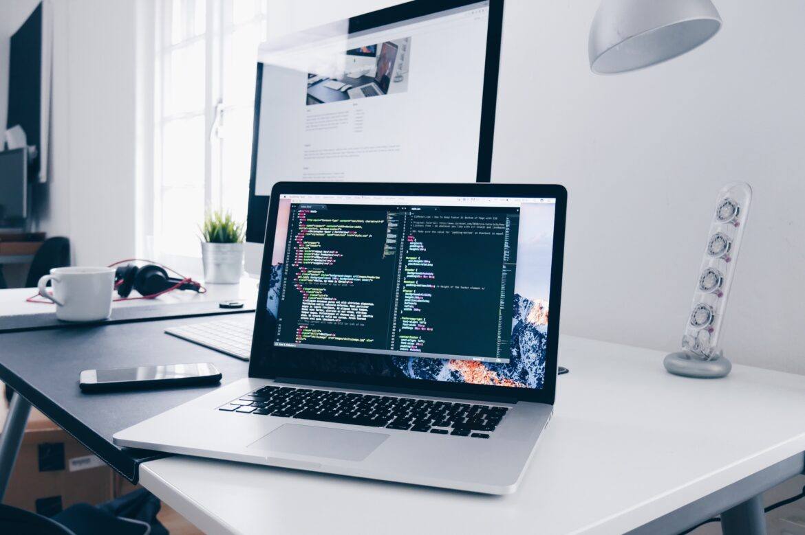 christopher-gower-m_HRfLhgABo-unsplash Laptop with code displayed on screen