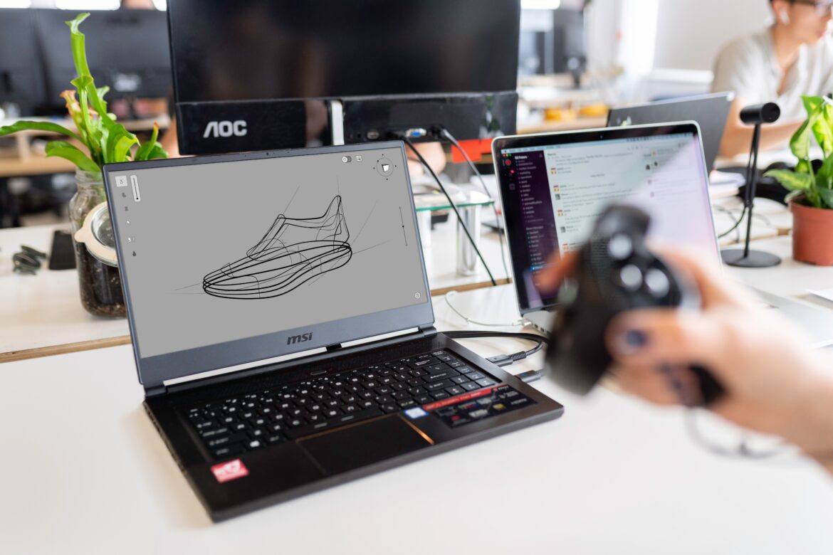 thisisengineering-raeng-jqD8bSQY6Ic-unsplash 3D design of a tennis shoe on a computer screen