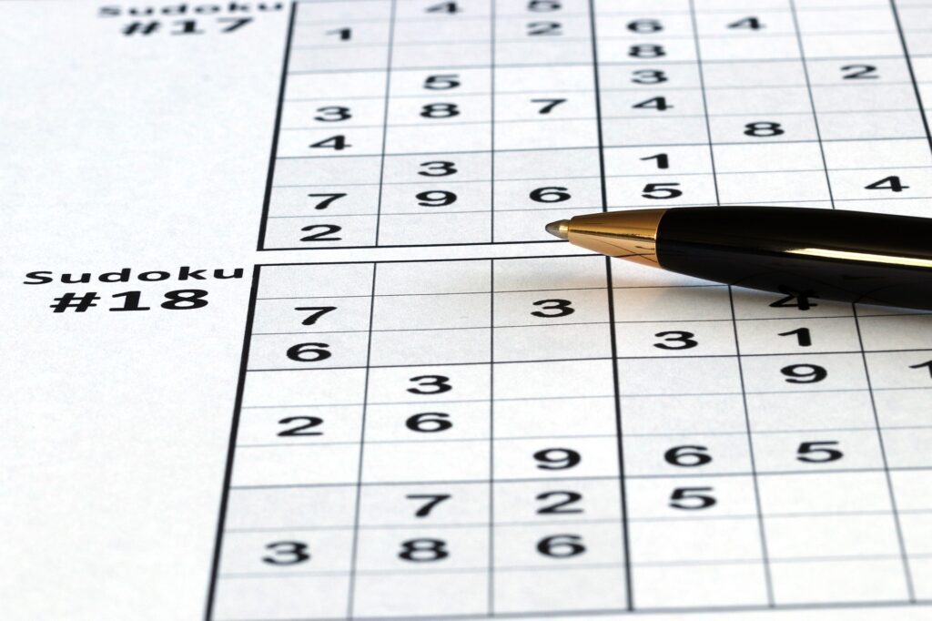 Sudoku puzzle with pen. 