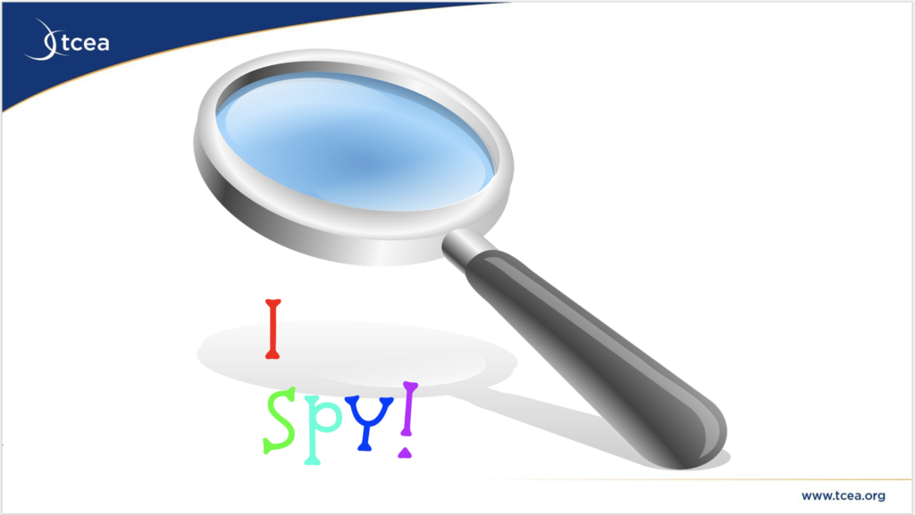 Magnifying glass image with I Spy beginning slide of the deck