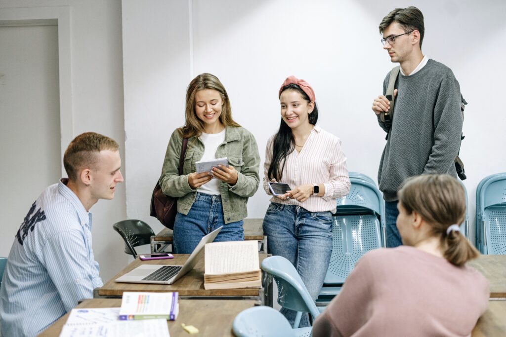 group of students talking in office