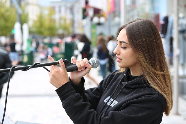 singer holding microphone