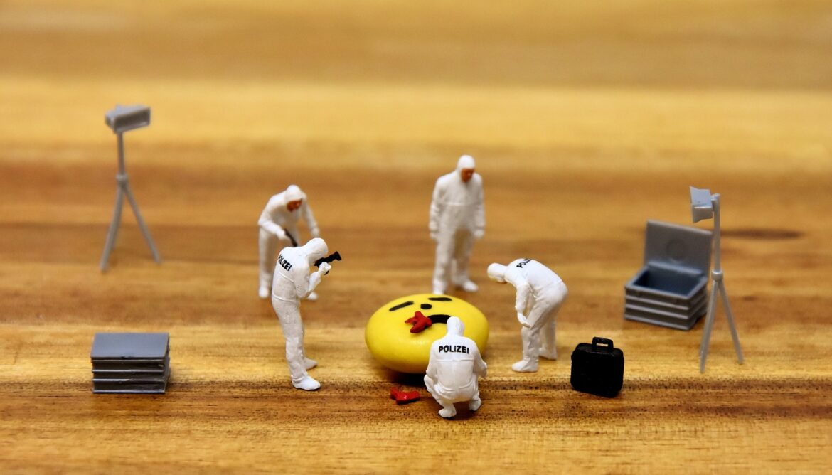 crime scene with tiny men and an m&M
