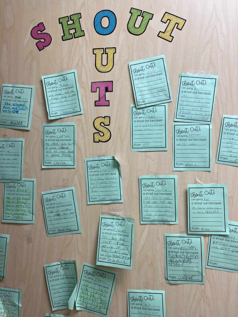 Image of a door where students display Shout Out cards they've written to each other.