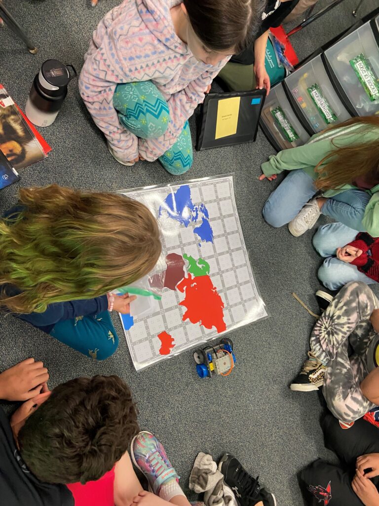 Image of students identifying continents using the VEX GO