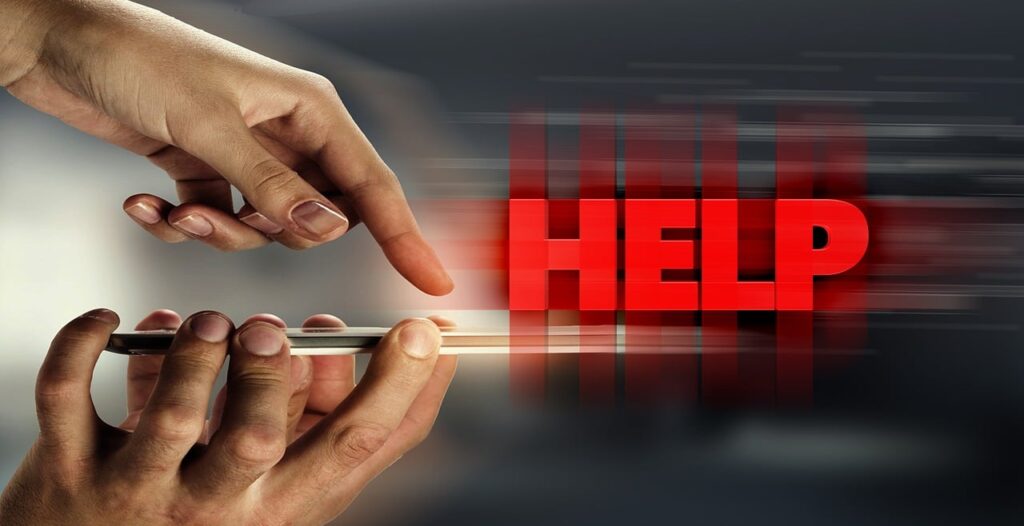 Hands holding and interacting with a smartphone, with the word "HELP" in bold red letters emerging from the screen in a motion blur effect.